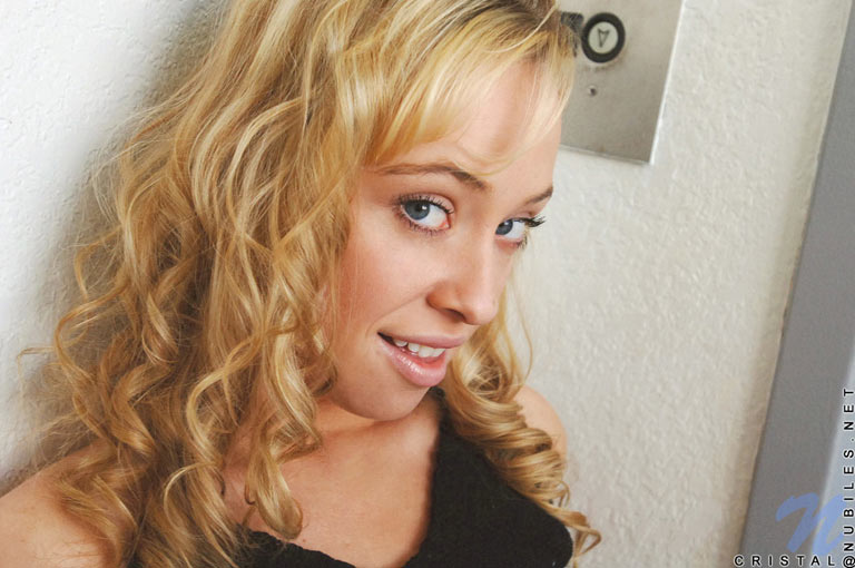 Cristal is waiting for the elevator and gets bored so she plays with her hot box and tits